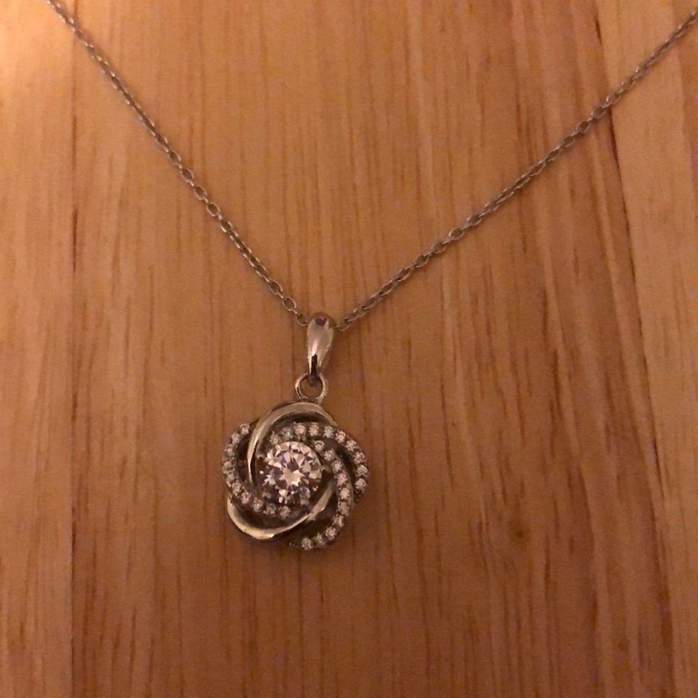 Beautiful flower/crossed/loop diamond necklace